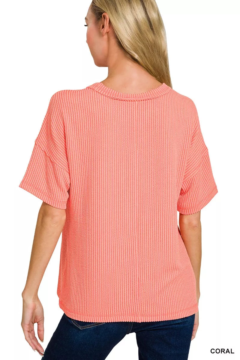 Raised rib short sleeve top with exposed seams and chest pocket