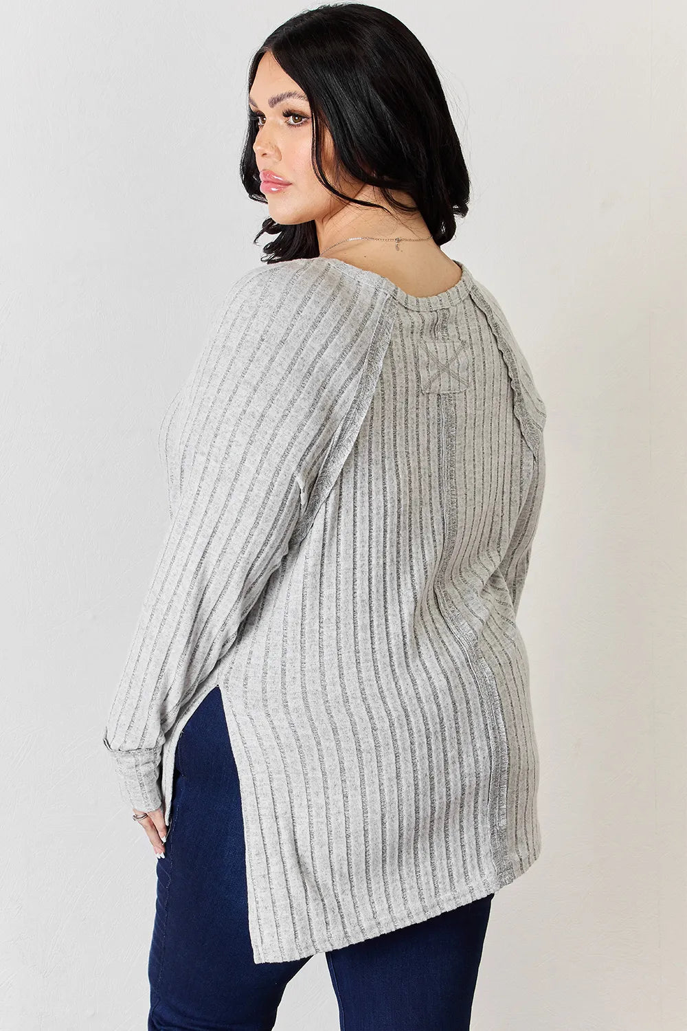 Ribbed knit round neck long sleeve top with side slits
