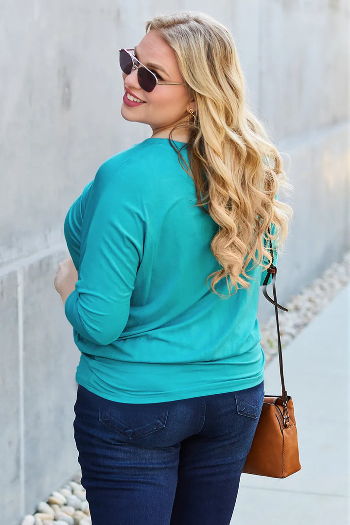 Batwing sleeve top with banded blouson hem