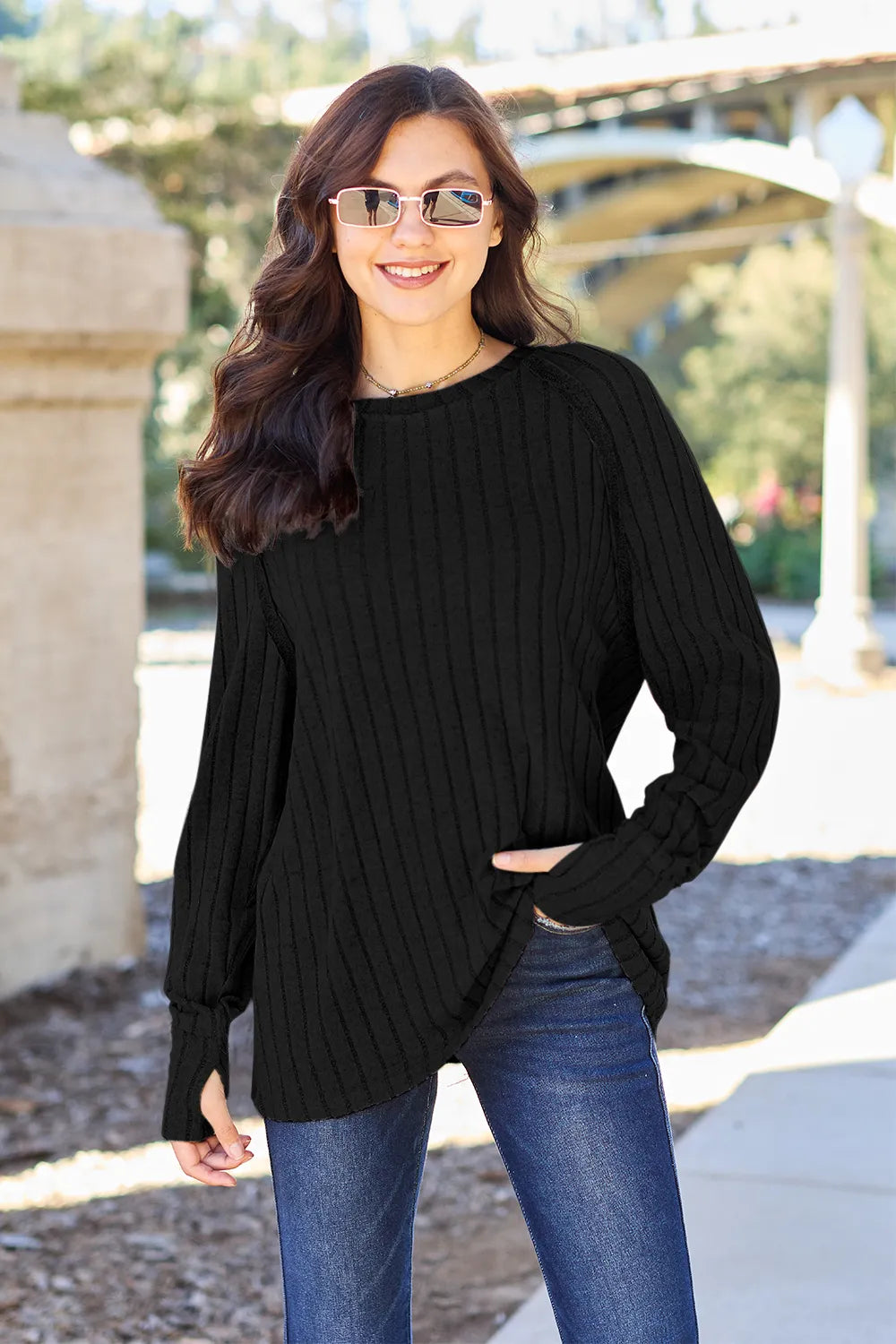 Black Ribbed knit round neck long sleeve top with curved hem
