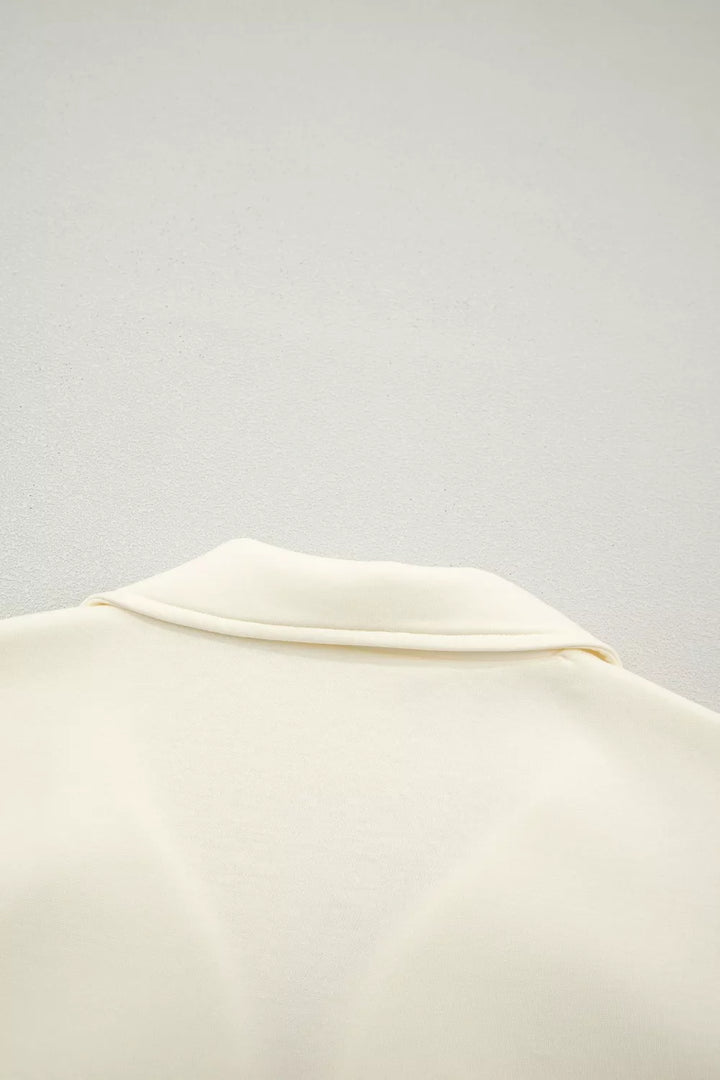 Ruffle cap sleeve half-zip stand collar blouse