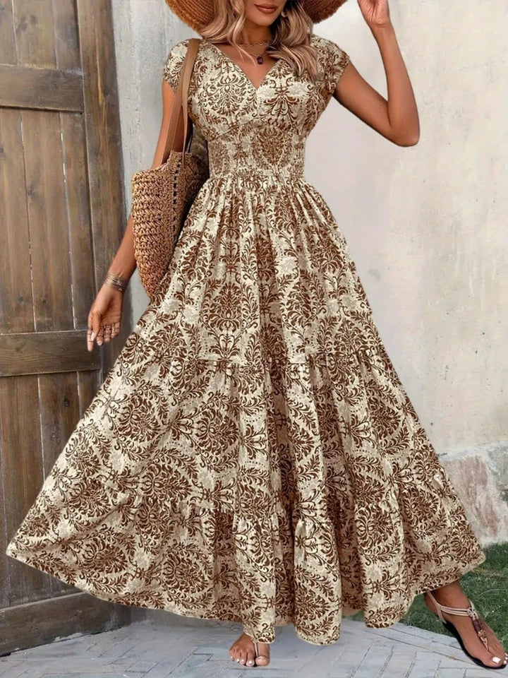Smocked tiered maxi dress with cap sleeves and side slit