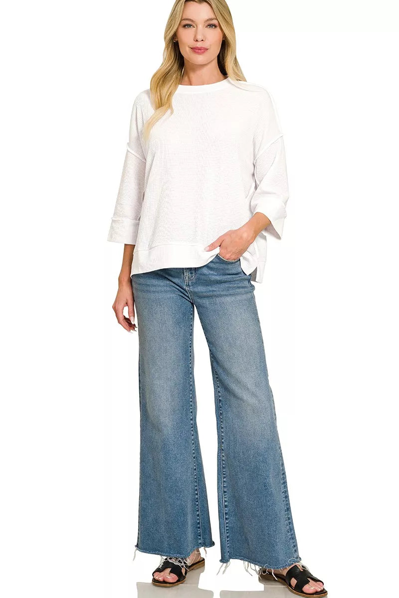 Double knit crew neck pullover top with 3/4 sleeves and side slits