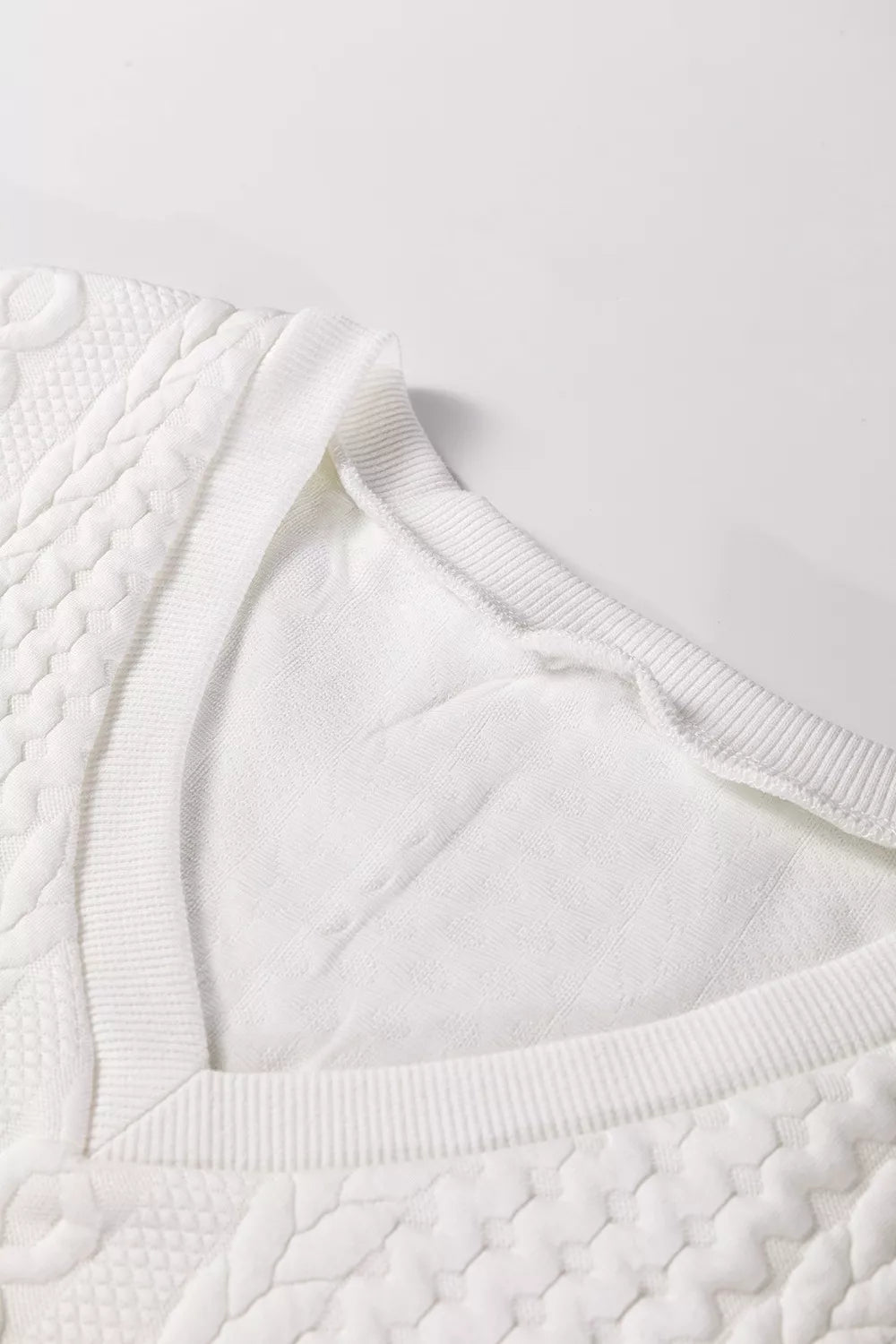 Cable-knit drop-shoulder V-neck pullover sweater