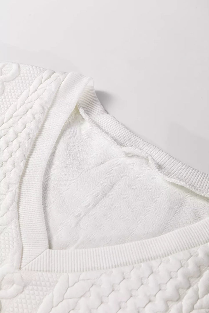 Cable-knit drop-shoulder V-neck pullover sweater