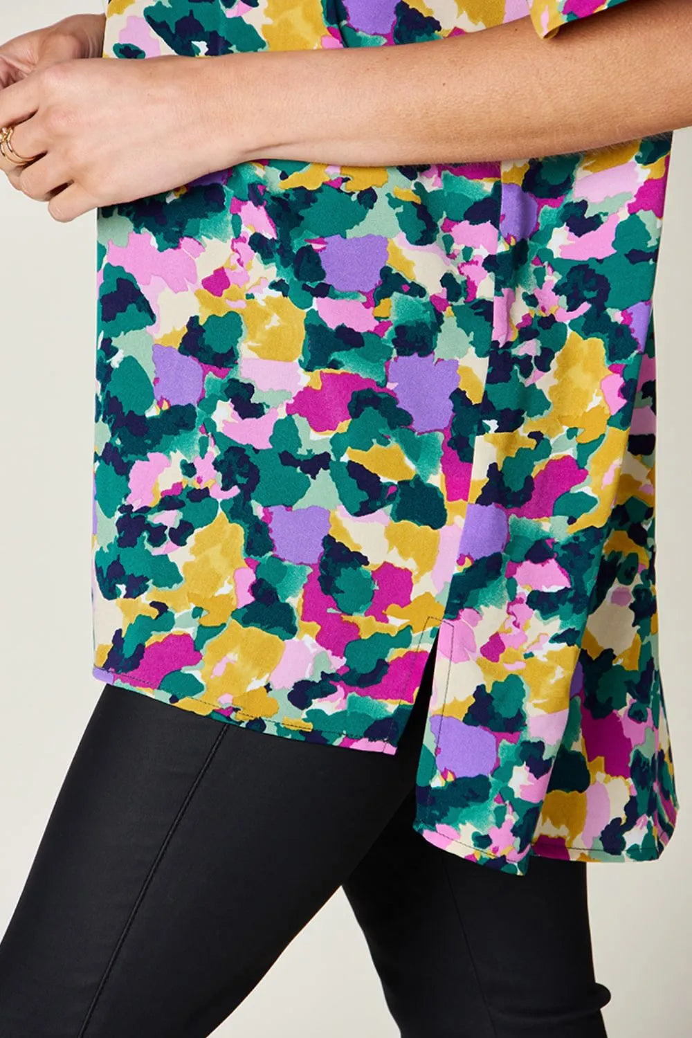 Abstract print v-neck tunic top with flutter sleeves and side slits