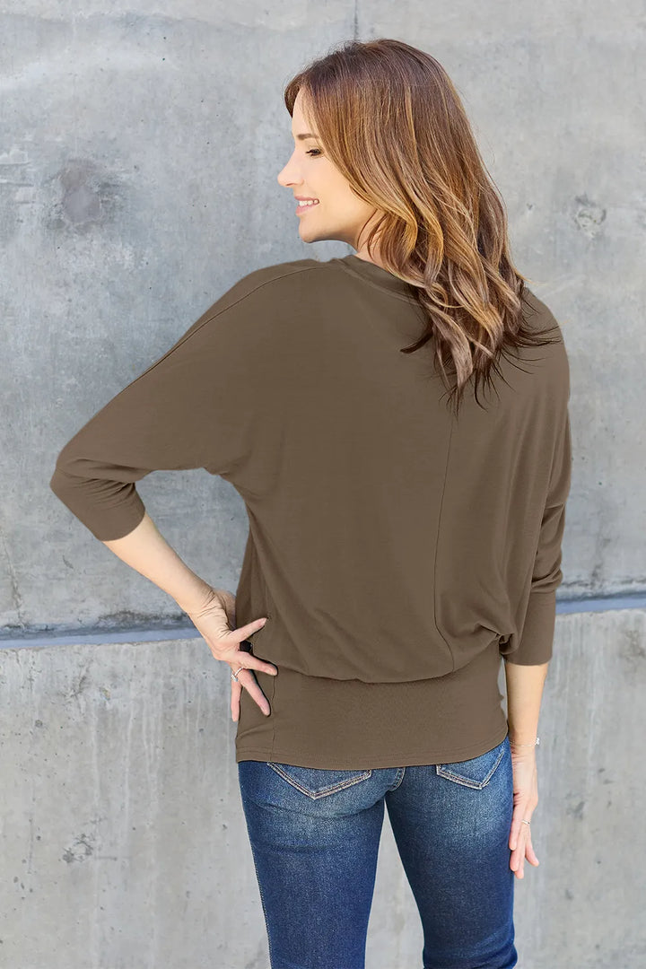 Batwing sleeve top with banded blouson hem