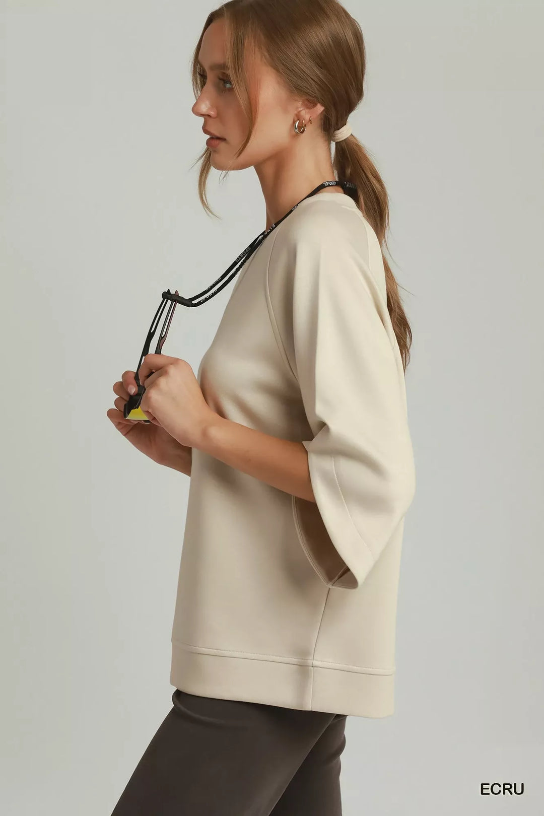 Relaxed raglan pullover with wide sleeves and ribbed hem
