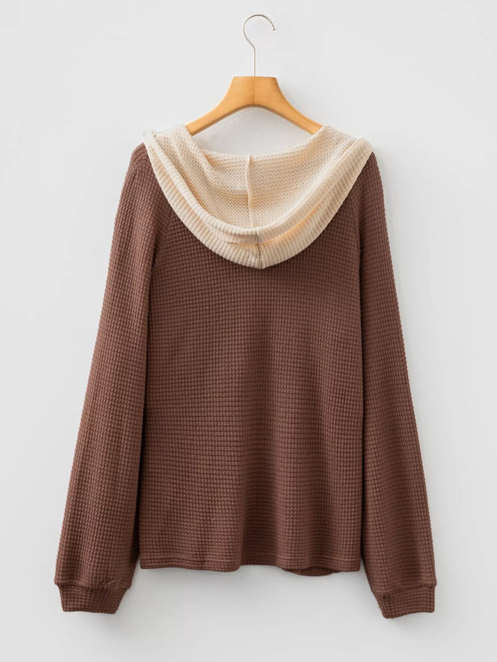 Waffle knit half-button hooded pullover with contrast trim