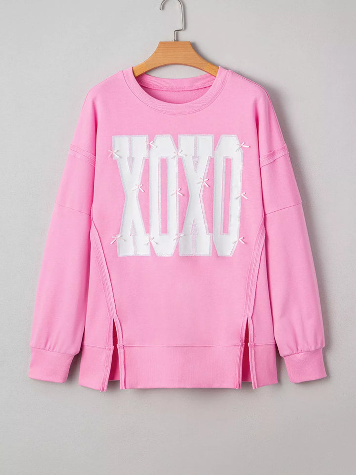 Oversized XOXO graphic sweatshirt with exposed seams and bows