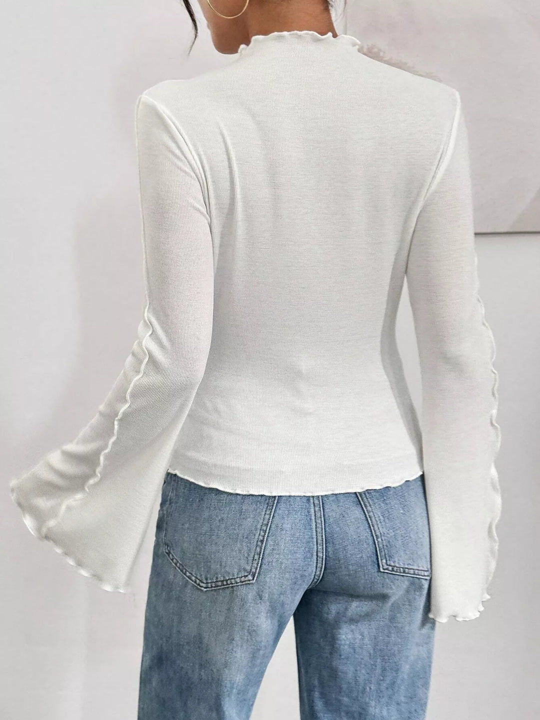 Ribbed knit mock neck top with lettuce-edge flare sleeves