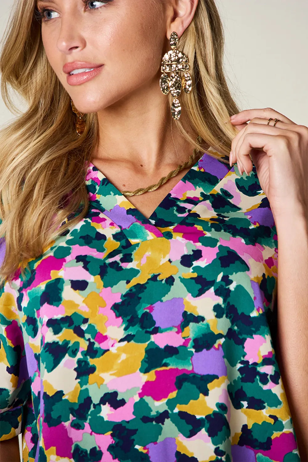 Abstract print v-neck tunic top with flutter sleeves and side slits