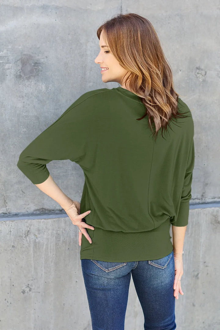 Batwing sleeve top with banded blouson hem