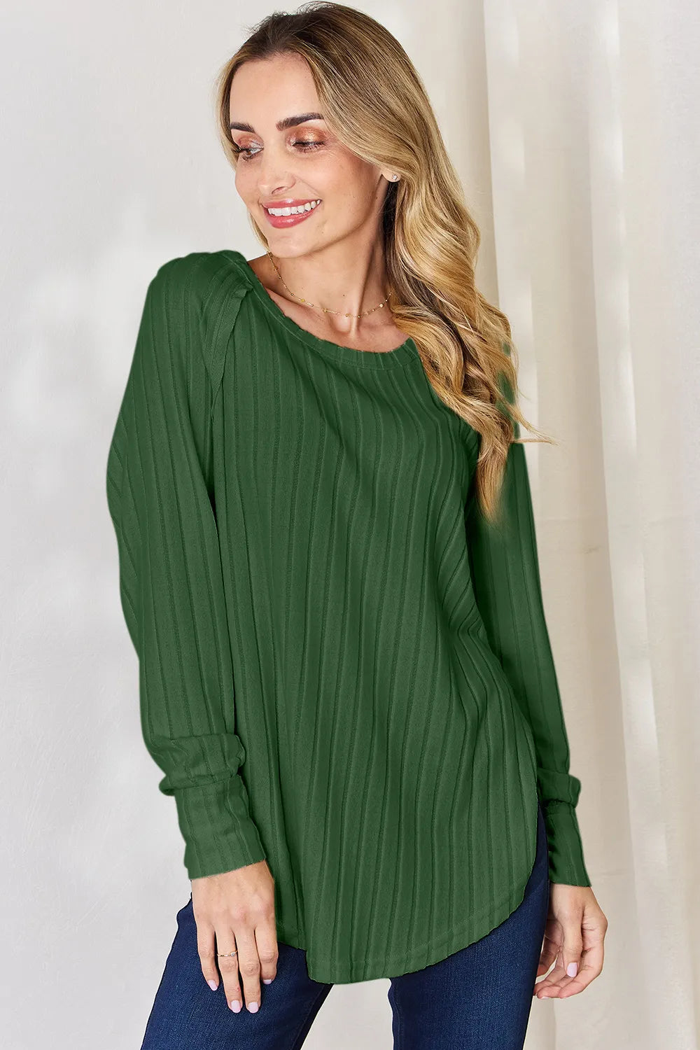 Ribbed knit round neck long sleeve top with side slits