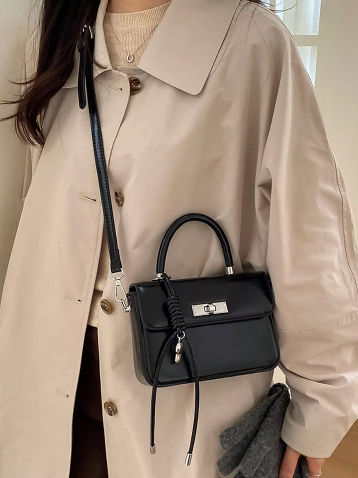 Black Mini top-handle crossbody bag with silver twist lock