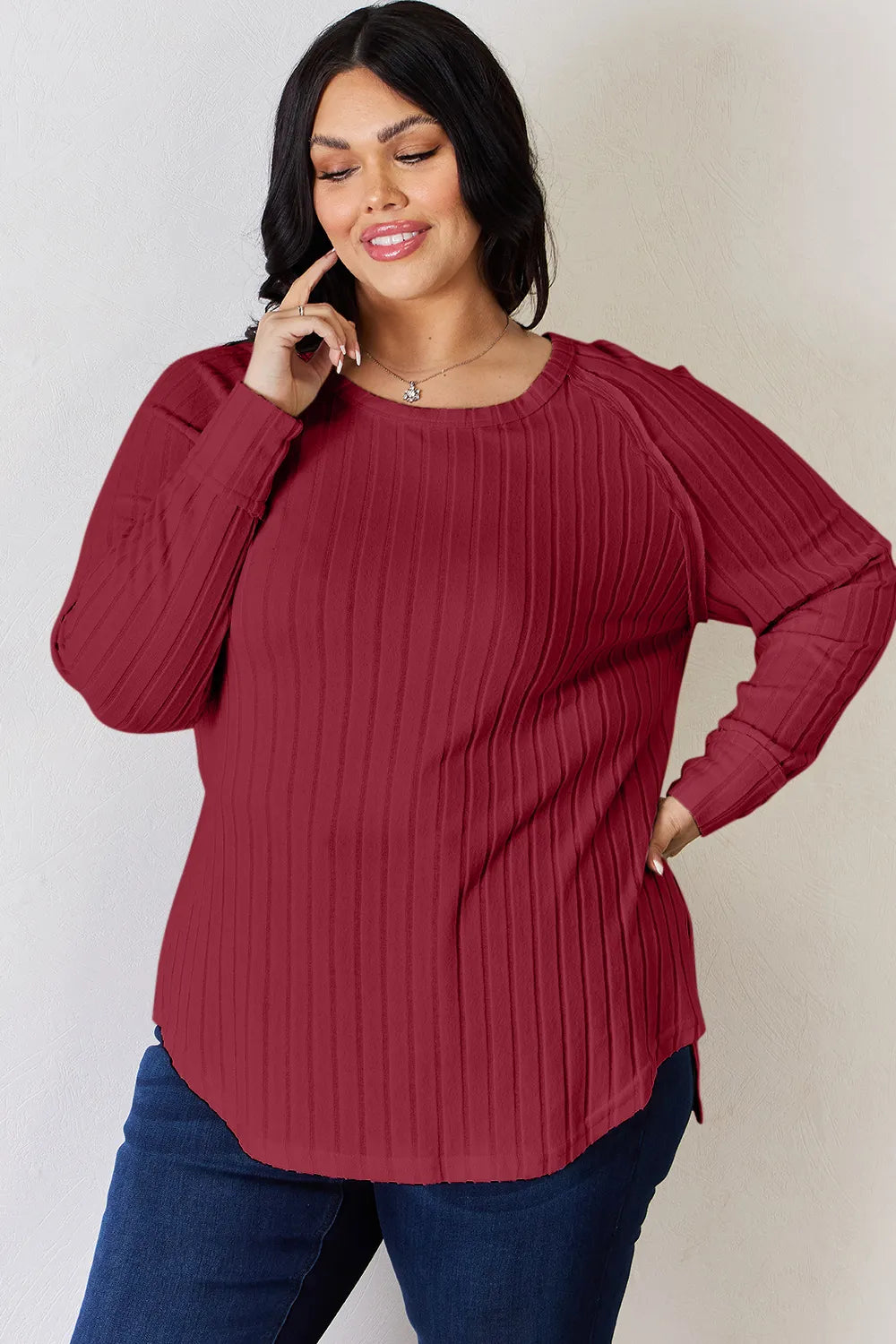 Ribbed knit round neck long sleeve top with side slits