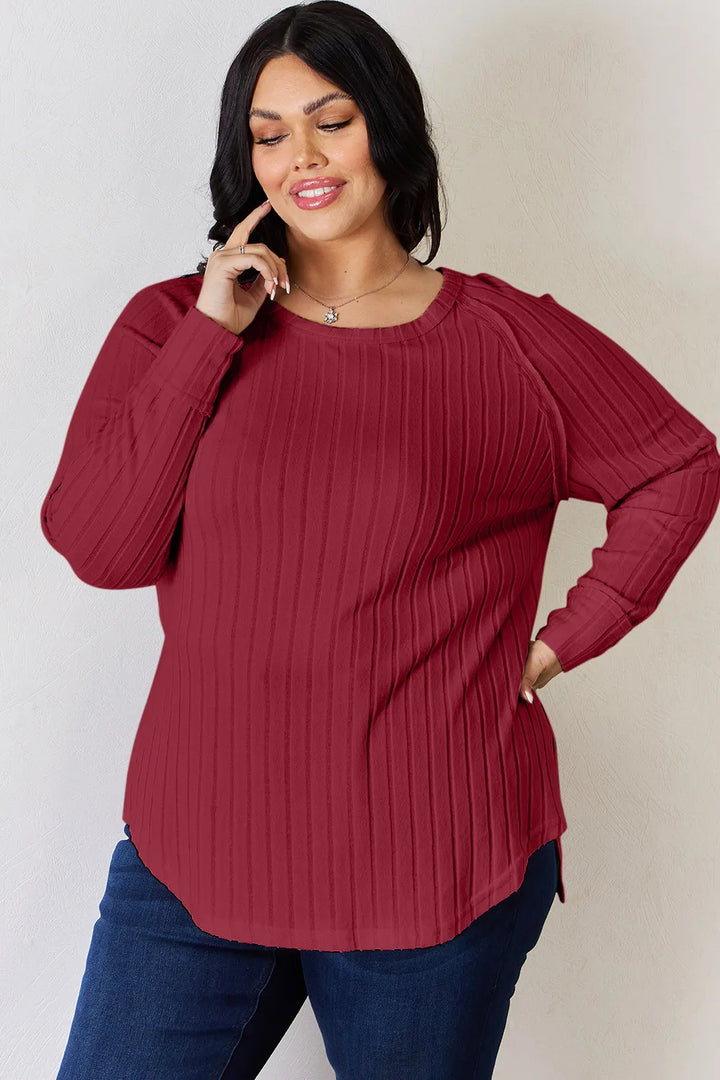 Ribbed knit round neck long sleeve top with side slits
