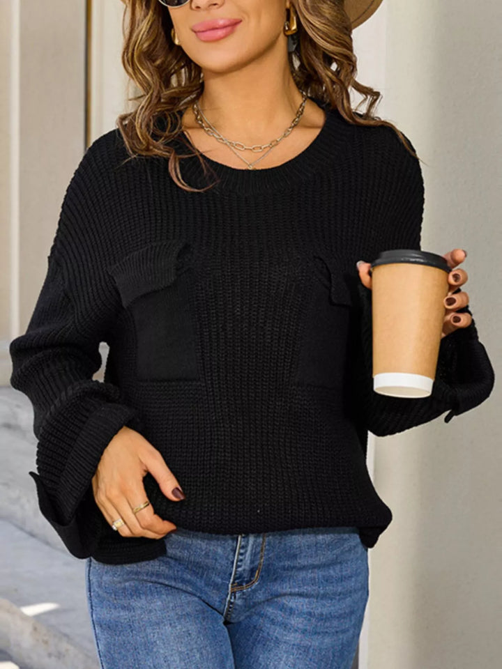 Ribbed knit sweater with chest pockets and button cuffs