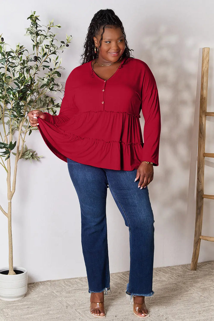 Half-button long sleeve blouse with tiered ruffle hem