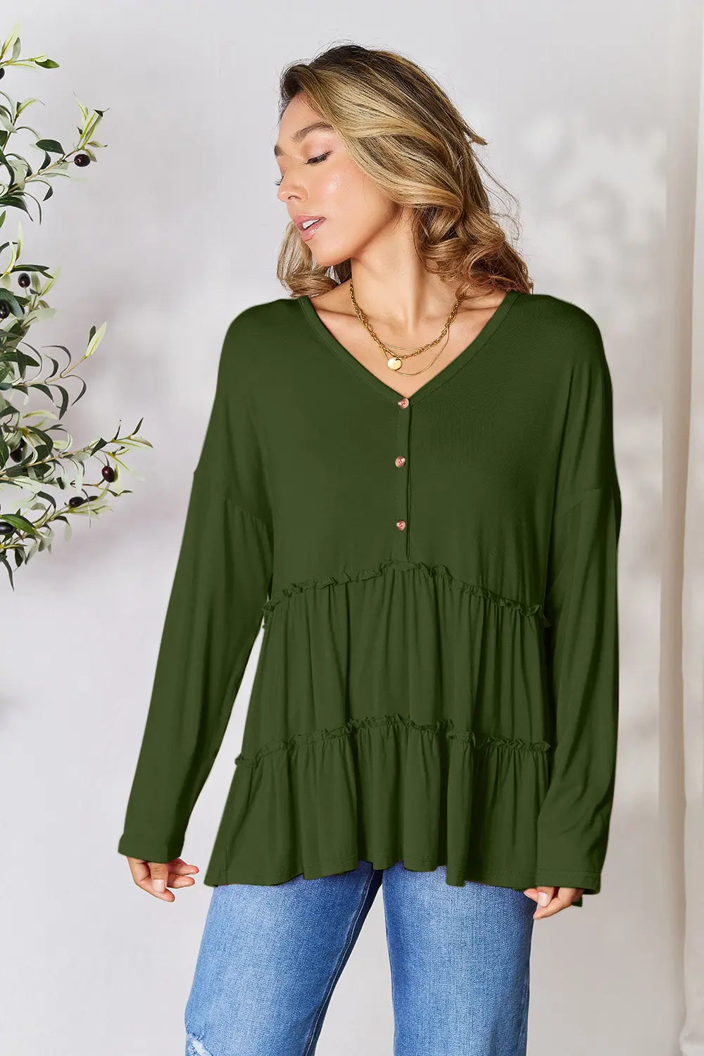 Half-button long sleeve blouse with tiered ruffle hem