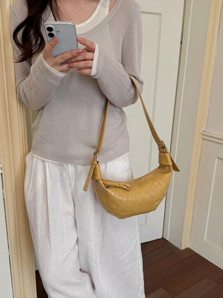 Croissant crossbody bag with adjustable strap and zip top