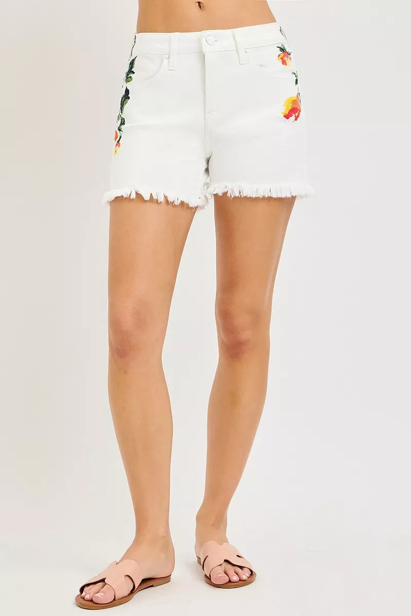High-rise embroidered floral denim shorts with raw hem