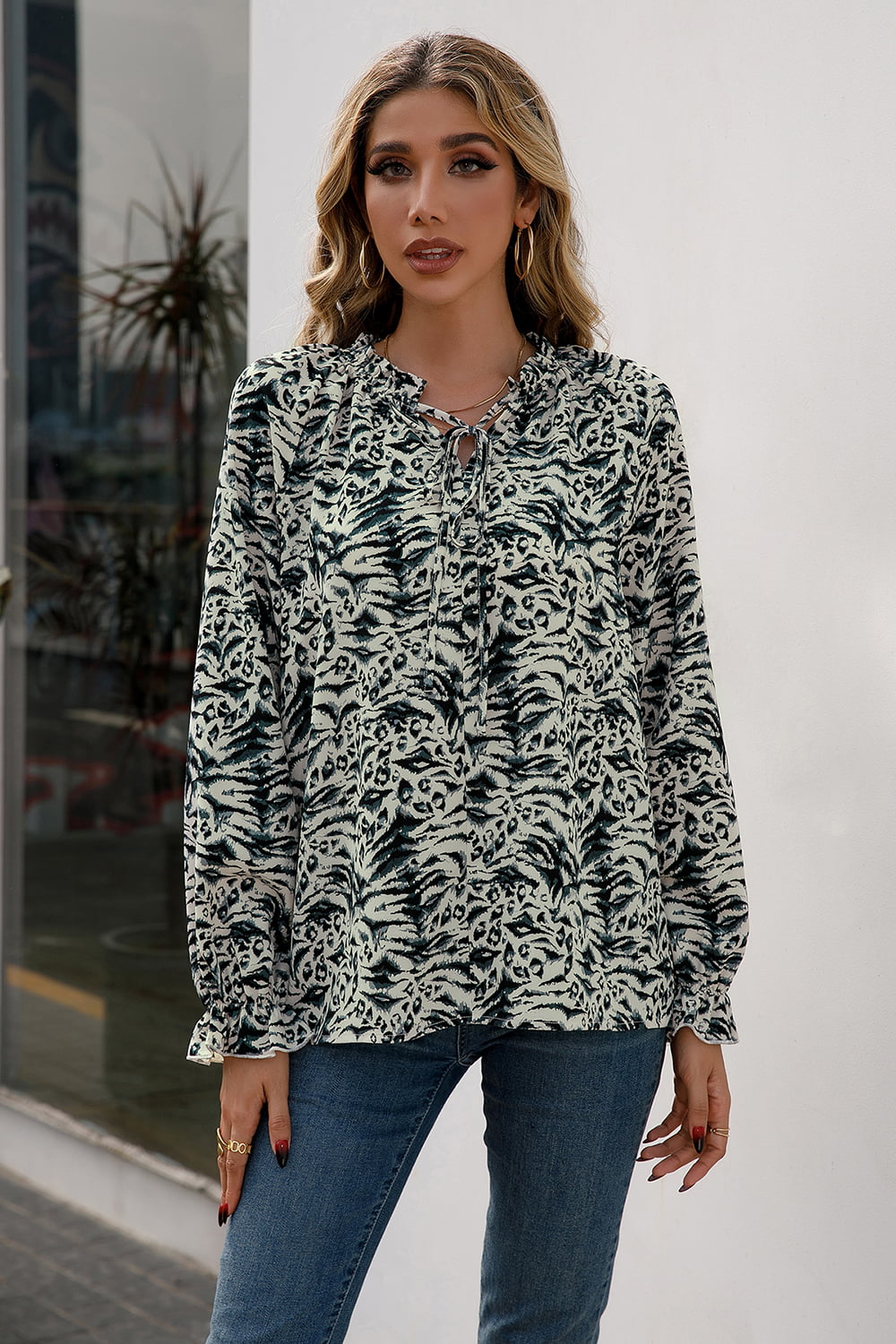 Animal print tie-neck blouse with flounce sleeves