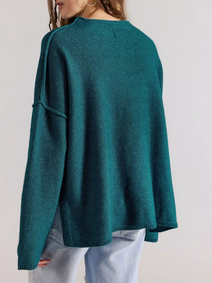 Exposed seam oversized knit sweater with wide sleeves