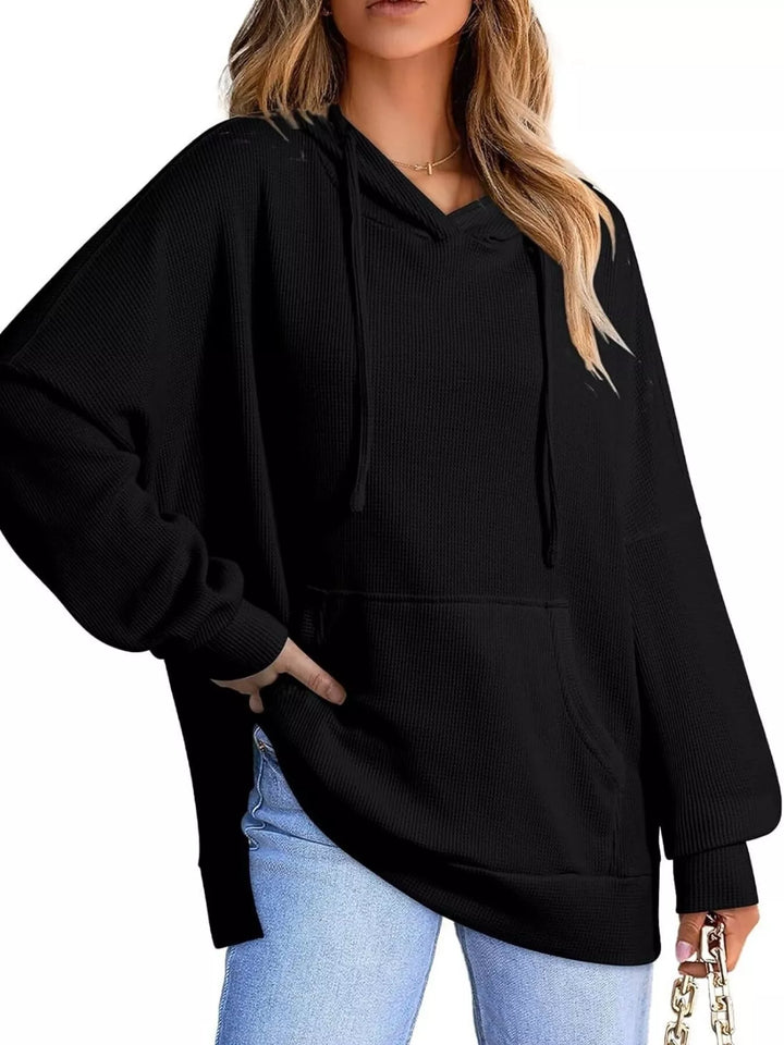 Oversized waffle-knit hoodie with side slits and front pocket