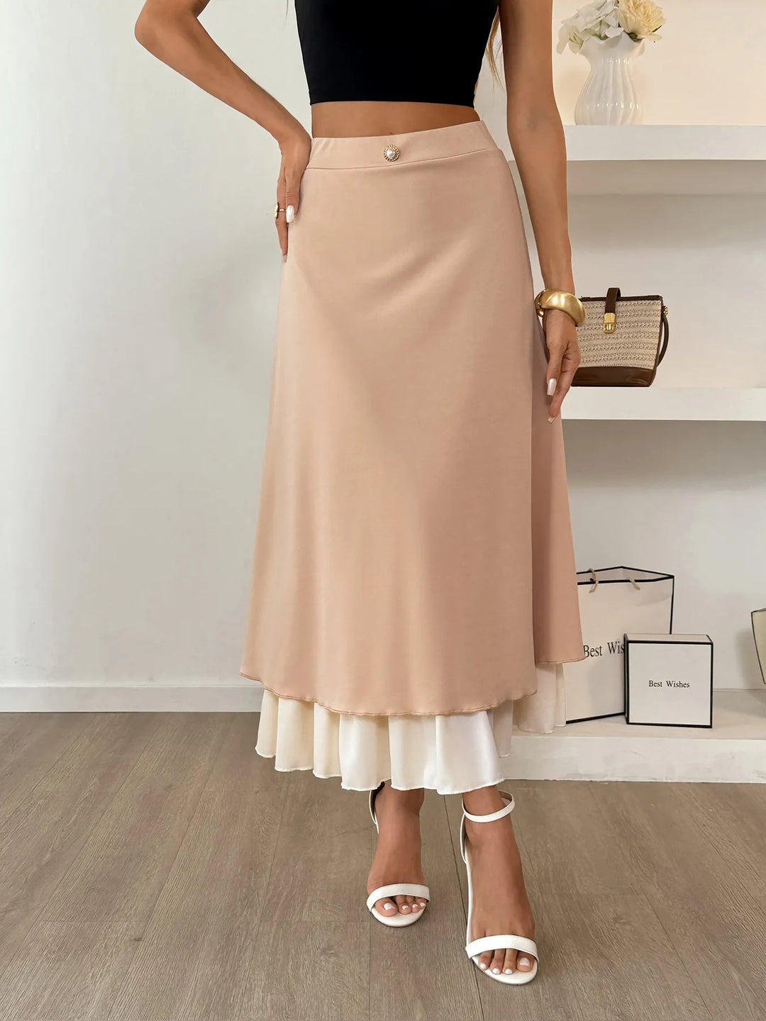 Layered A-line midi skirt with contrast ruffle hem