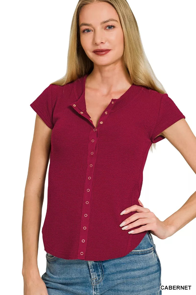 CABERNET Ribbed double knit snap button short sleeve top