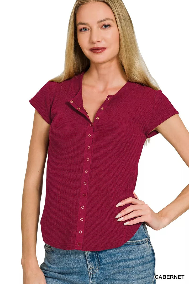 CABERNET Ribbed double knit snap button short sleeve top