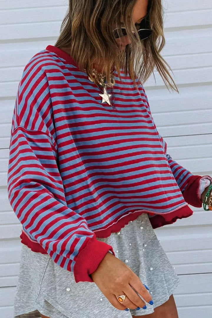 Striped exposed-seam oversized sweatshirt with contrast trim