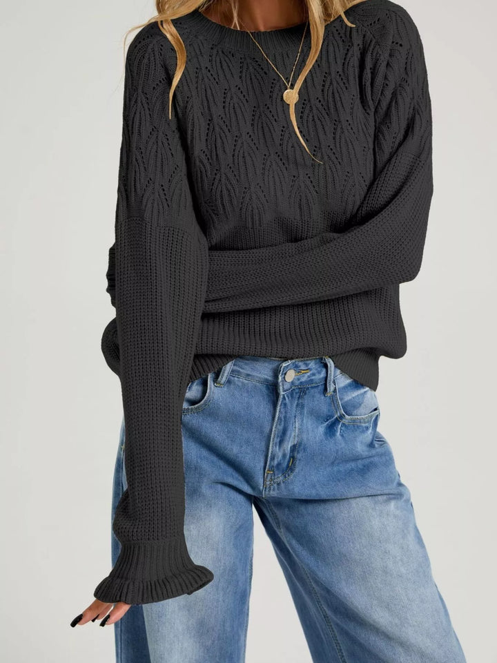 Black Pointelle openwork knit sweater with ruffle cuffs
