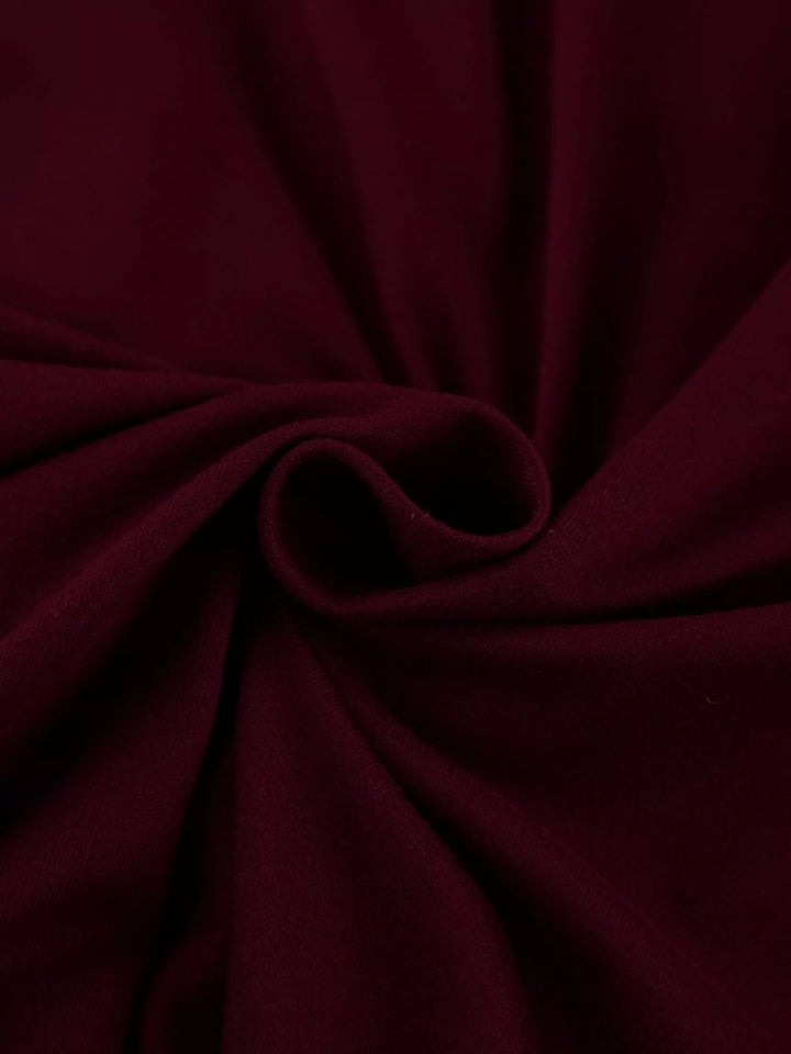 Draped cowl neck long sleeve top with ruched sides