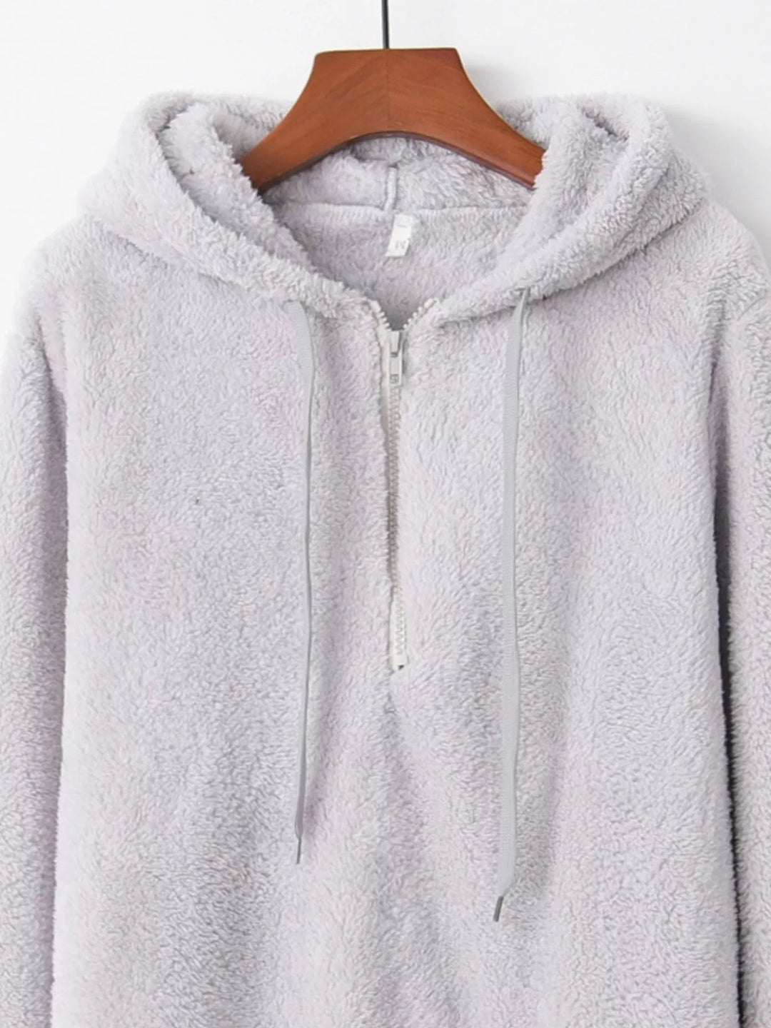 Plush half-zip fleece hoodie with drawstring hood and pockets