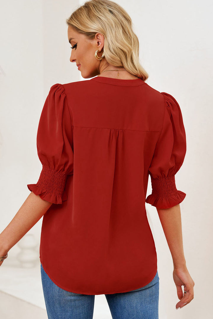Notched neck blouse with smocked flounce sleeves
