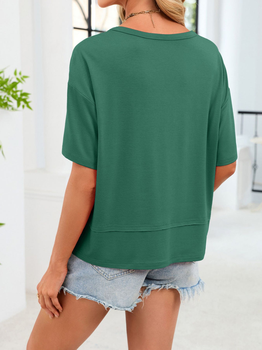 Relaxed-fit V-neck short sleeve tee with raw hem