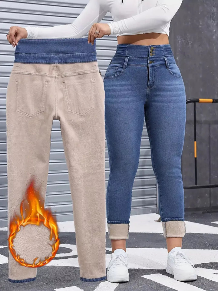 High-rise fleece-lined skinny jeans with stacked button waist