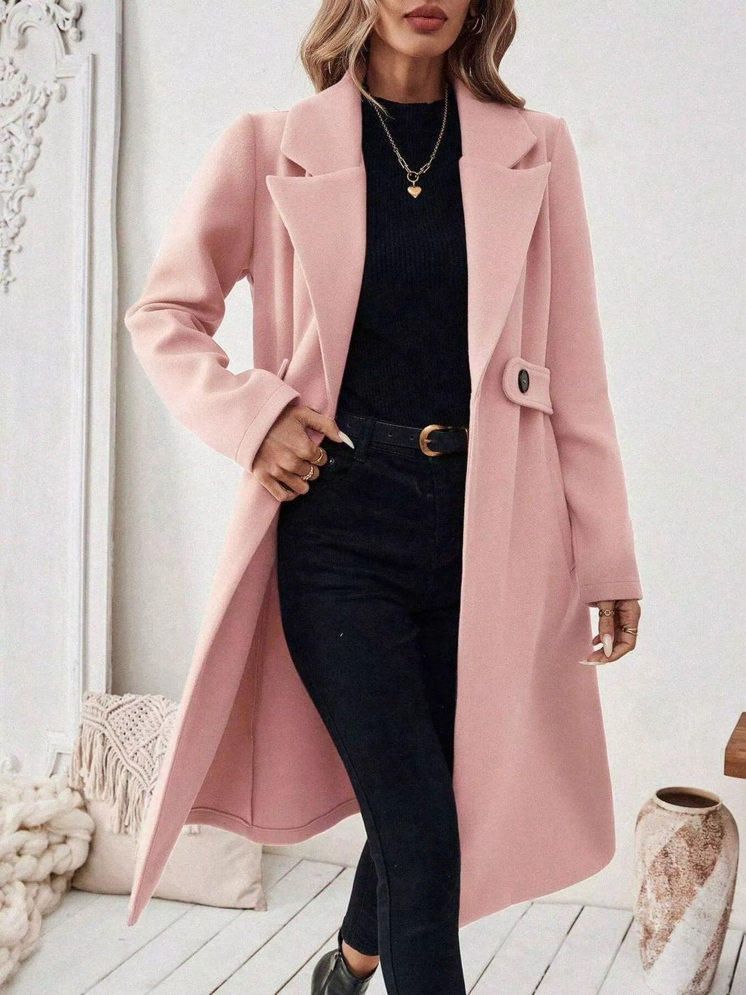 Longline notch lapel coat with single-button waist tab