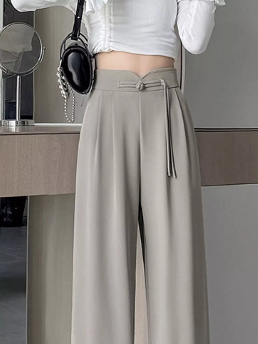 High-rise wide-leg pants with pleated front and tie waist