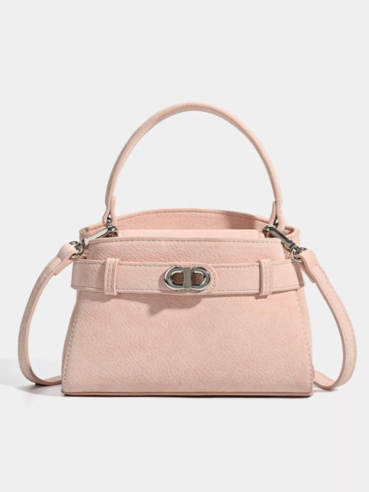 Mini belted crossbody bag with top handle and twist lock