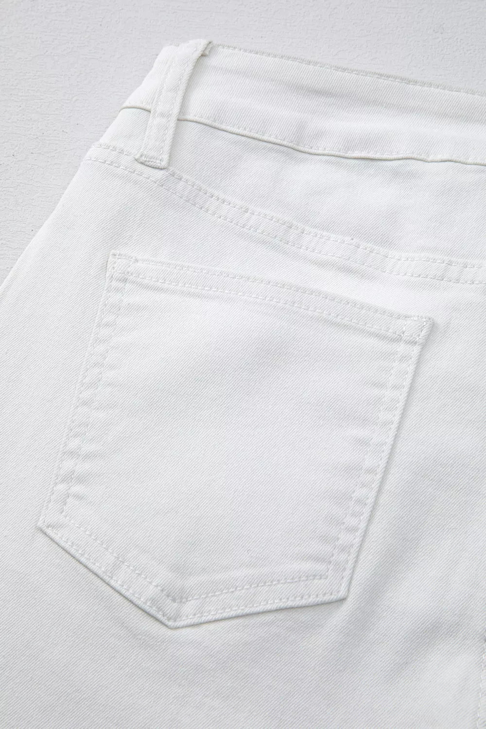High-rise straight leg jeans with released hem
