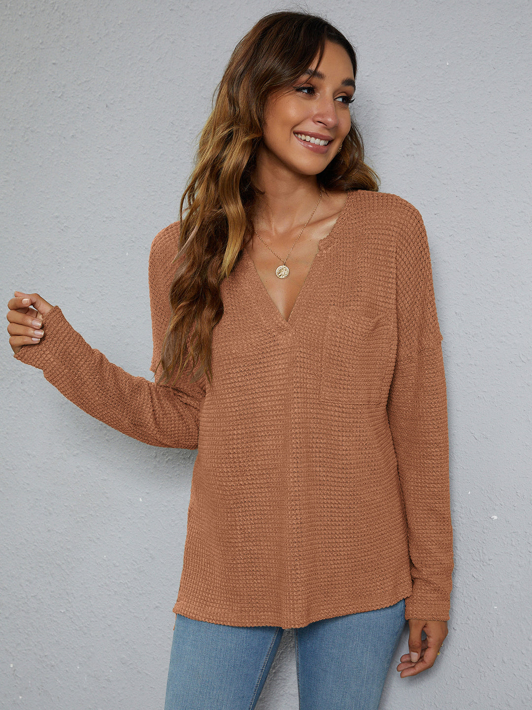 Dropped-shoulder waffle-knit V-neck top with high-low hem