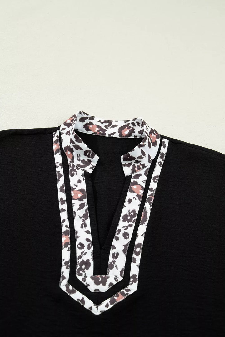 Plus size notched V-neck top with leopard collar trim