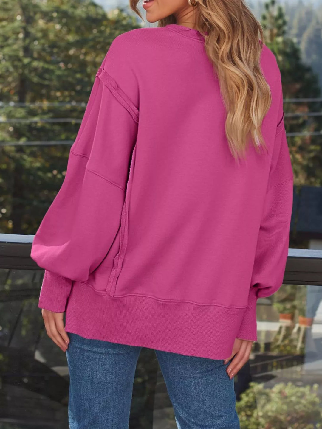 Oversized side-slit sweatshirt with exposed seams