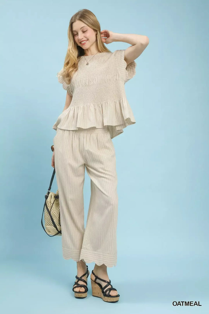 Pinstripe smocked peplum top with ruffle cap sleeves
