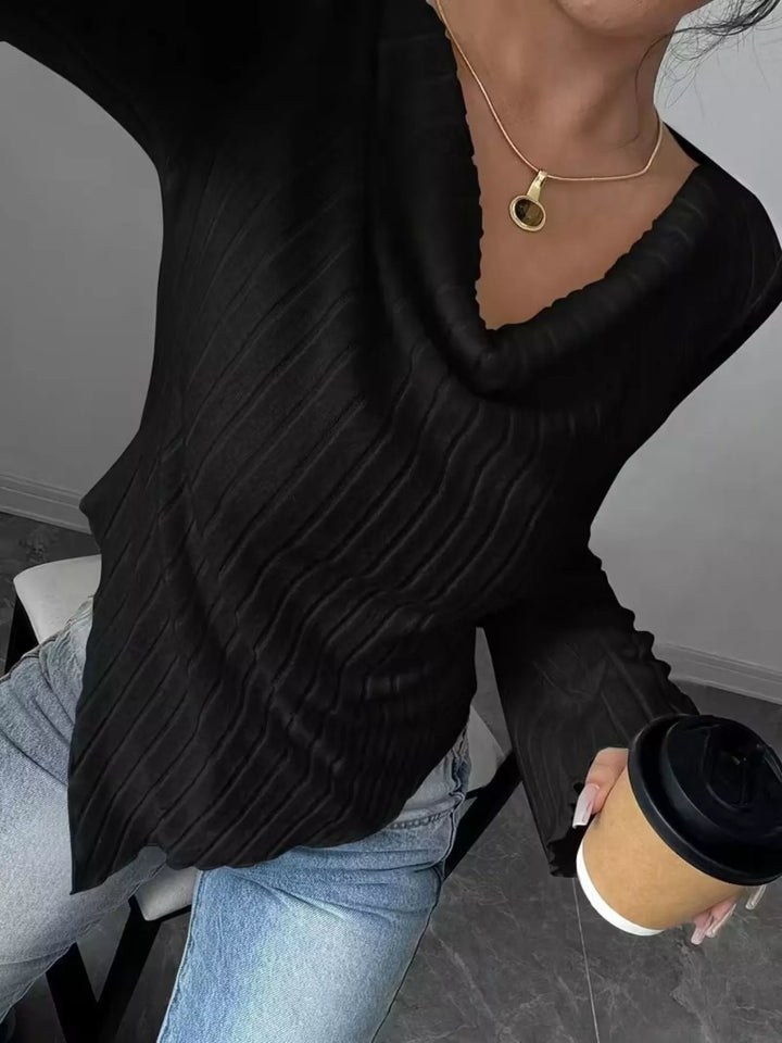 Ribbed knit top with asymmetric hem and flared sleeves