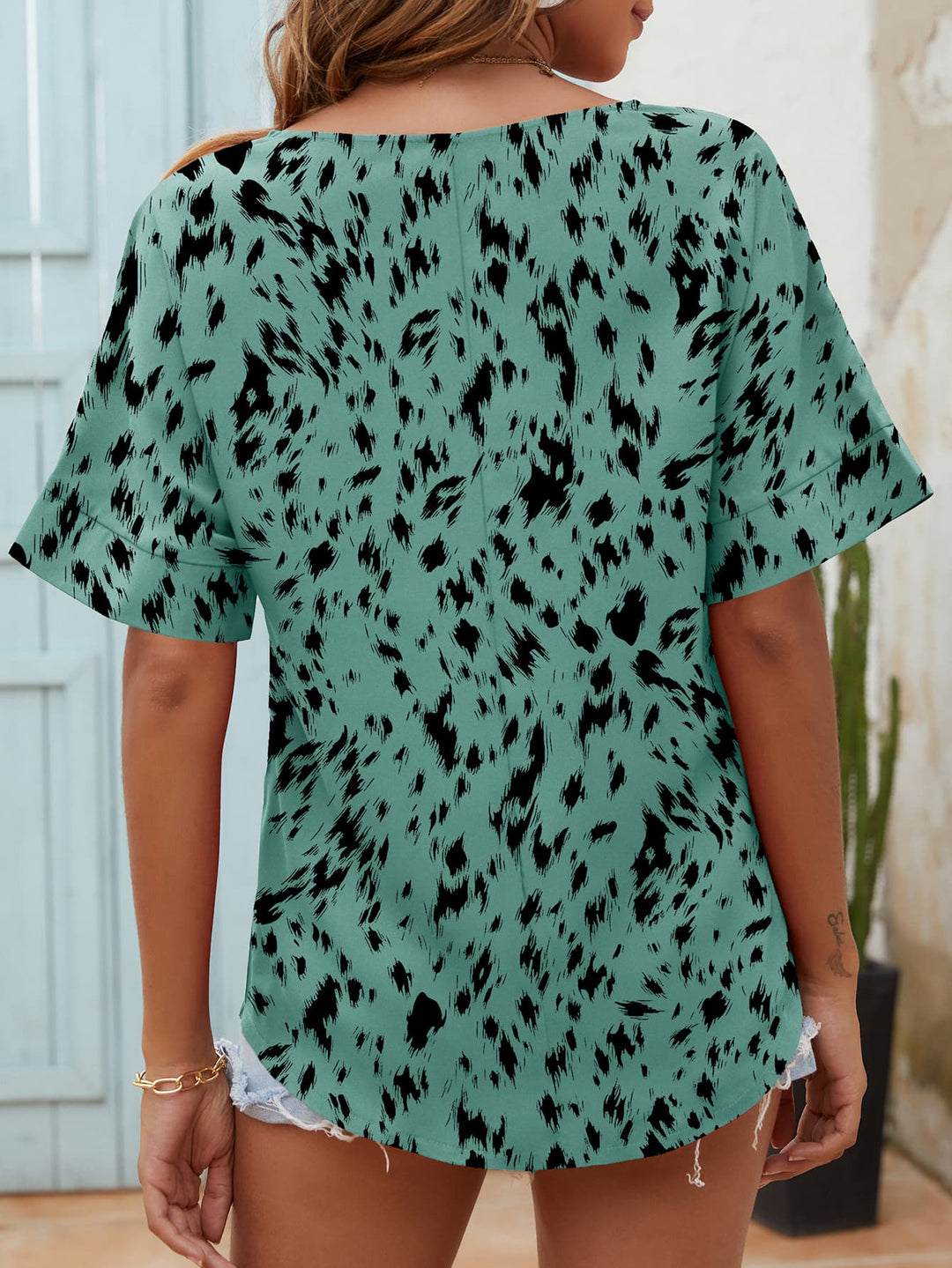 Animal print notched neck short sleeve blouse