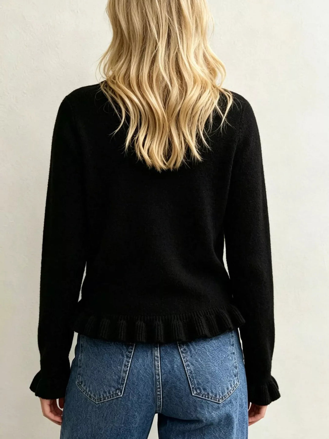 Ruffle hem crew neck knit sweater with ruffled cuffs